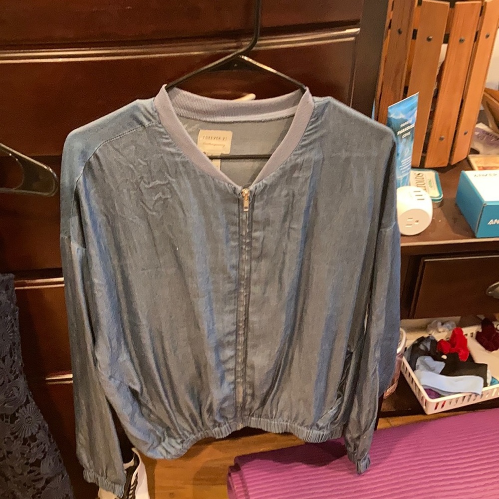 Zip up denim colored jacket